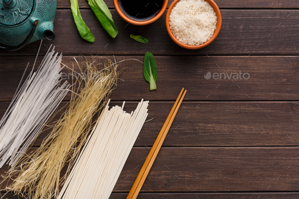 Different kinds of pasta on wooden table - Stock Photo - Images