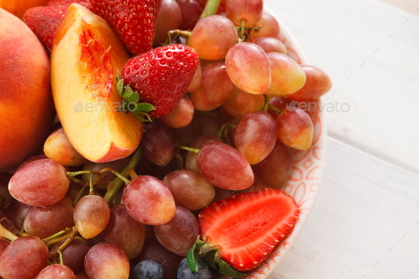Mixed fruits and berries in glass bowls closeup, top view - Stock Photo - Images