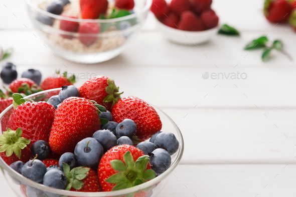 Mixed berries in glass bowls closeup, selective focus - Stock Photo - Images
