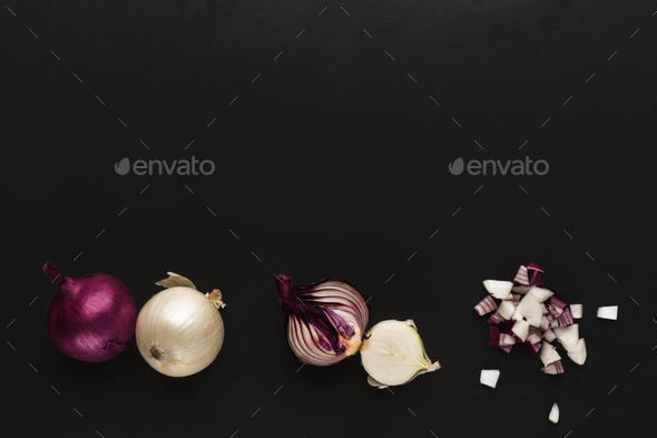 Whole and cut violet onion on black isolated background - Stock Photo - Images
