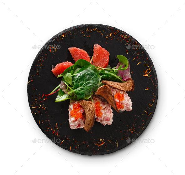 Gourmet seafood snack on black plate isolated - Stock Photo - Images