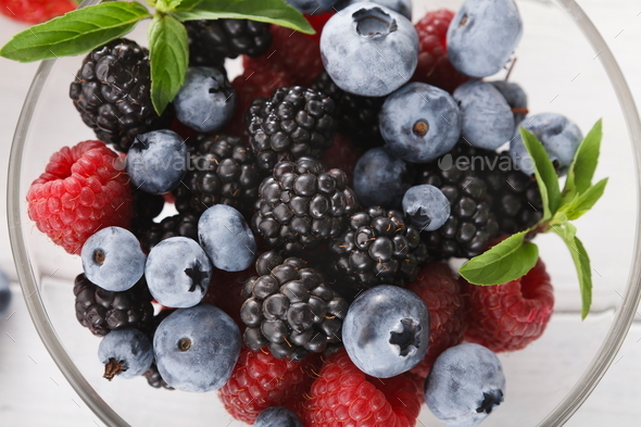 Mixed berries in glass bowls closeup, top view - Stock Photo - Images