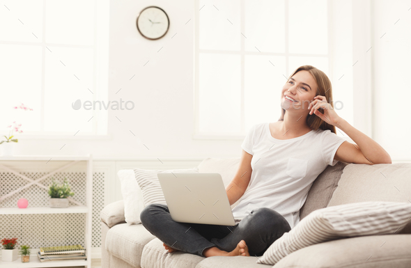 Young girl with laptop indoors - Stock Photo - Images