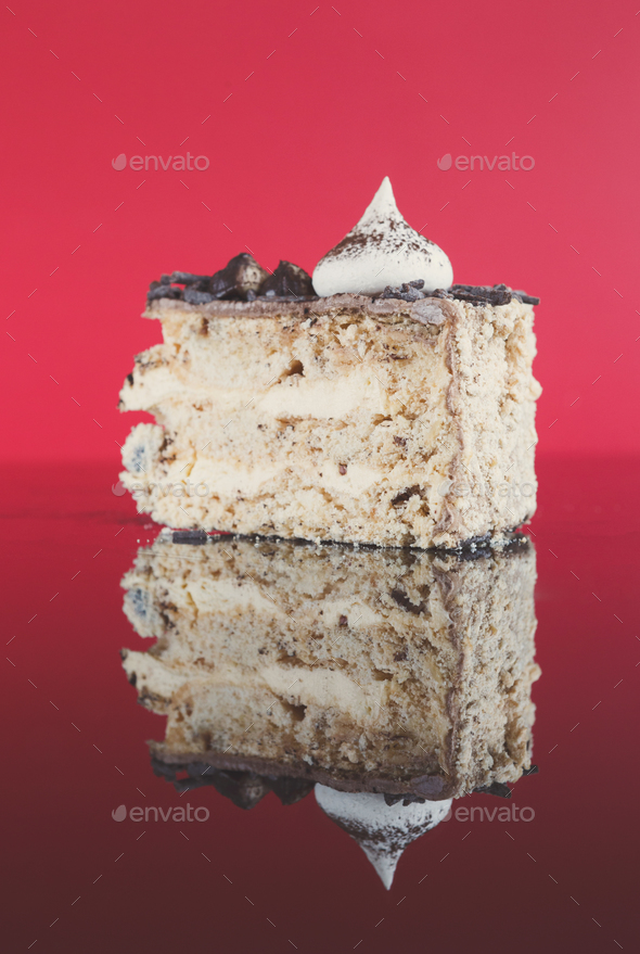 Meringue cake slice with hazelnuts and buttercream - Stock Photo - Images