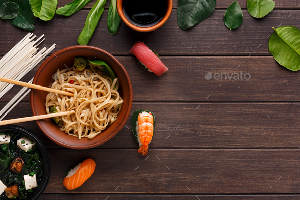 Bowl of rice noodles with soy souce on wood - Stock Photo - Images