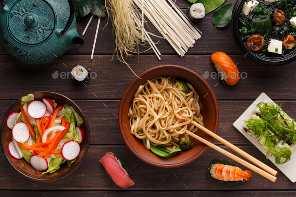 Asian food on wooden background, copy space - Stock Photo - Images