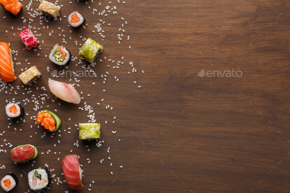 Set of sushi, maki and rolls with sesame on wooden rustic background, copy space - Stock Photo - Images