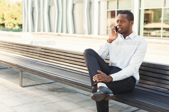 Black businessman outdoors in smart casual ware - Stock Photo - Images