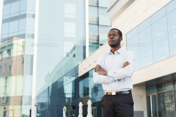 Black businessman outdoors in smart casual ware - Stock Photo - Images