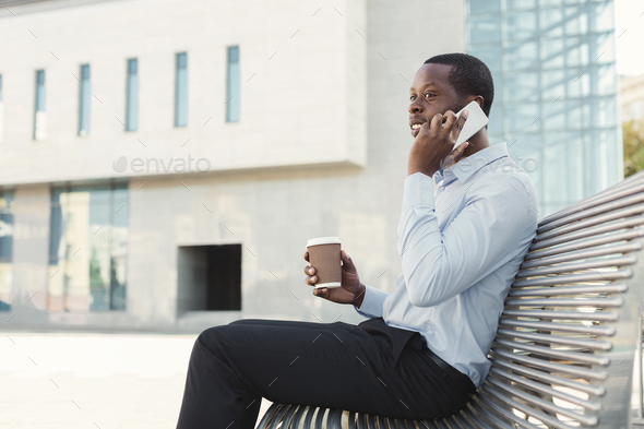 Black businessman outdoors in smart casual ware - Stock Photo - Images