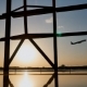 Silhouette of an Airplane Taking Off at Sunset at Beijing Airport in the Background of a Window. - VideoHive Item for Sale