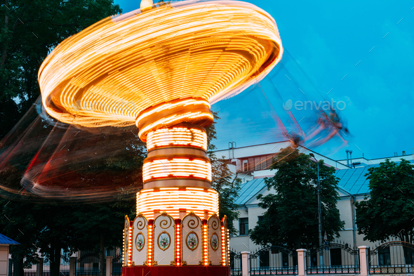 Blurred Motion Effect Of Illuminated Rotating Carousel Merry-Go- - Stock Photo - Images
