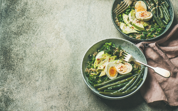 Healthy vegetarian breakfast bowls over grey concrete background, copy space - Stock Photo - Images