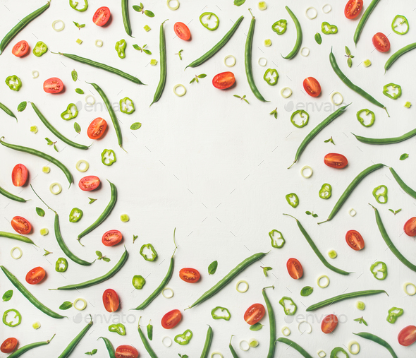 Flat-lay of fresh vegetable slices over white background, food frame - Stock Photo - Images