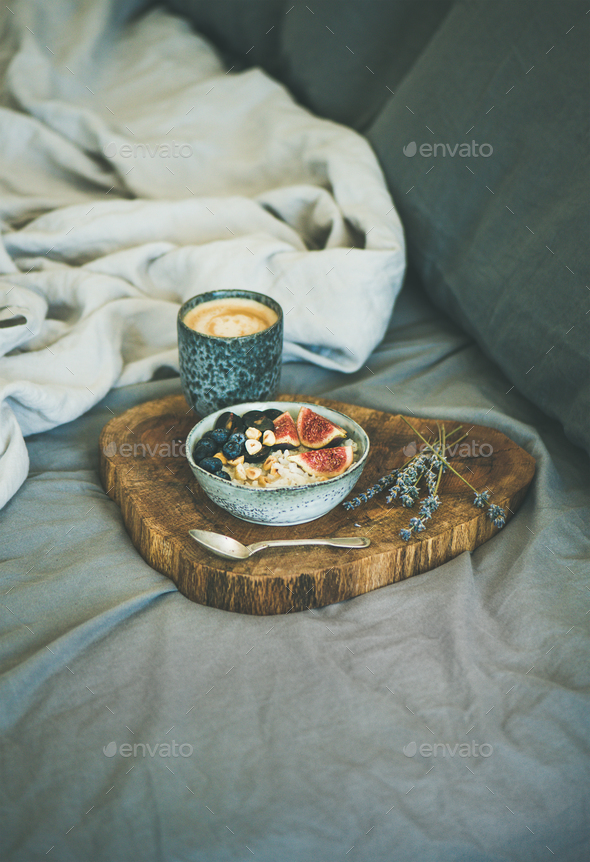 Rice coconut porridge and espresso in bed, copy space - Stock Photo - Images