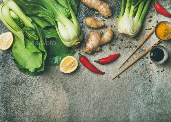 Flat-lay of Asian cuisine ingredients over concrete background, copy space - Stock Photo - Images