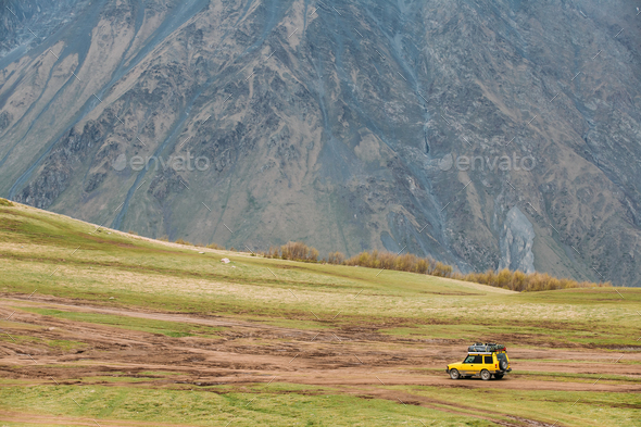 SUV Car On Off Road In Spring Mountains Landscape In Georgia. Dr - Stock Photo - Images
