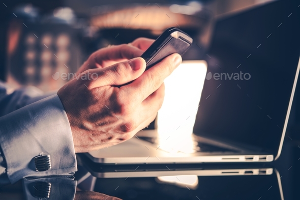 Businessman with Mobile Devices - Stock Photo - Images