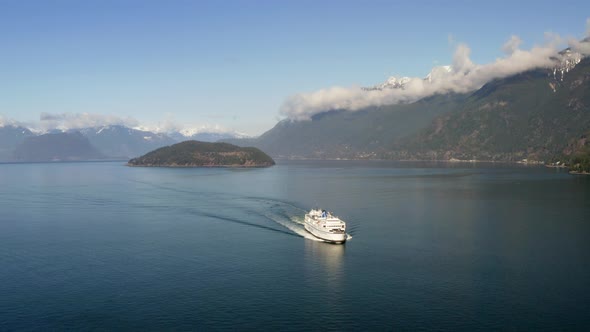 Ferry Boat Carrying Passengers Cruising In The Howe Sound With Bowyer Island In West Vancouver, BC, alt