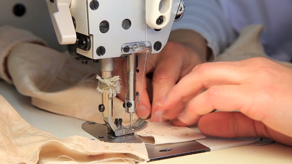Seamstress at Work By the Sewing-machine