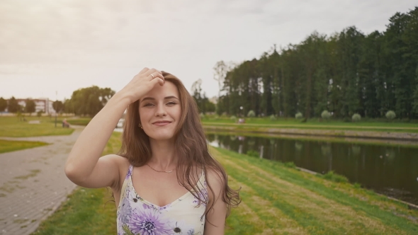 Beautiful Young Girl with Long Curly Hair in a Light Dress Goes To the ...