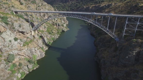 Aerial View of High Iron Bridge Over River with Tourist and Cars alt