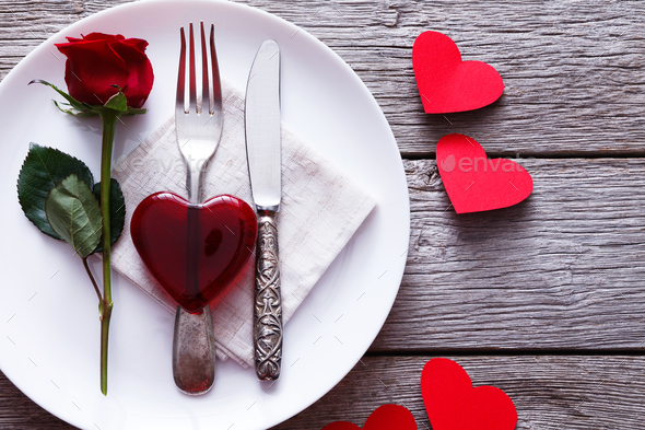 Valentine day background red glass heart on the plate - Stock Photo - Images