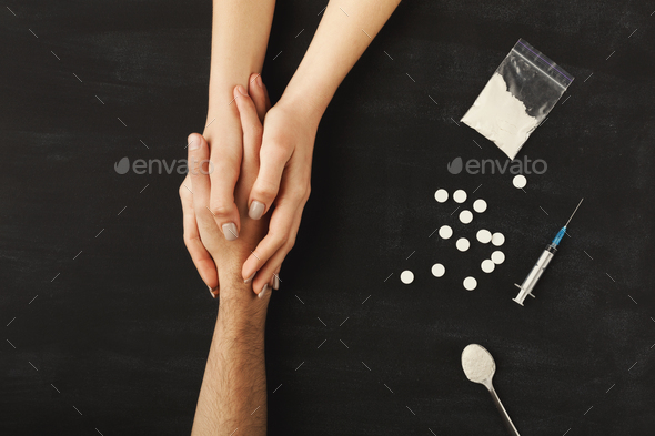 Drug addict hands on dark table - Stock Photo - Images