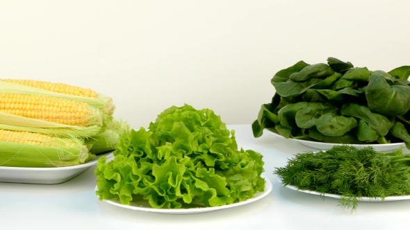 Fresh Healthy Vegetables in Plates on a Table.