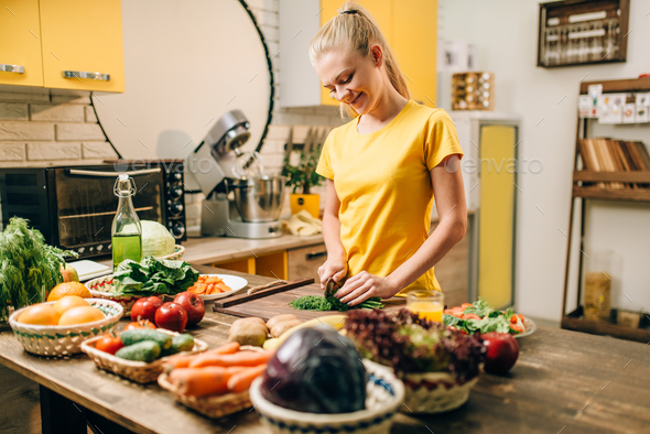 Housewife cooking, organic food preparation - Stock Photo - Images