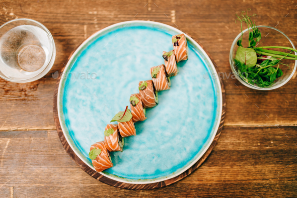 Sushi rolls with salmon fish on plate, top view - Stock Photo - Images