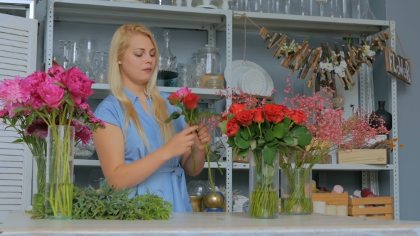 Professional Florist Making Floral Wedding Composition at Flower Shop