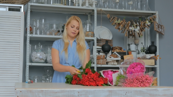 Professional Florist Working with Flowers at Studio