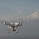 The Quadcopter Is Flying High Above Snowy Mountain - VideoHive Item for Sale