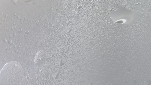 Drops of Steam From Hot Water on Misted Glass