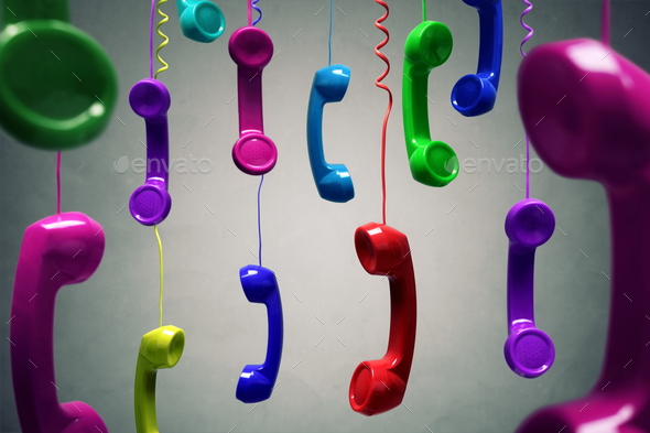 Red and multi-coloured telephone receiver hanging - Stock Photo - Images