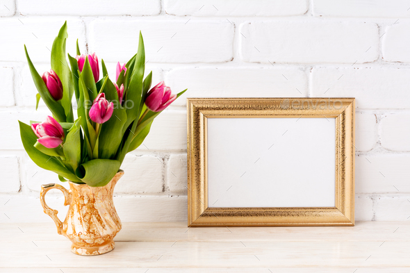 Golden landscape frame mockup with pink tulips in jug - Stock Photo - Images