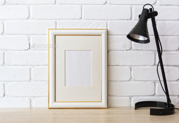 Gold decorated frame mockup with black lamp - Stock Photo - Images