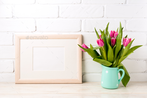 Wooden landscape frame mockup with pink tulips in jug - Stock Photo - Images