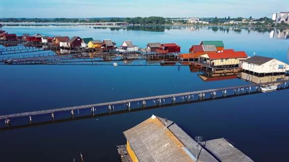 Flying Over Fishing Houses Line on the Lake Shore, Hungary alt