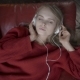 People Leisure Relax Concept. Young Woman in Headphones Listening Music and Relaxing at Home on Sofa - VideoHive Item for Sale