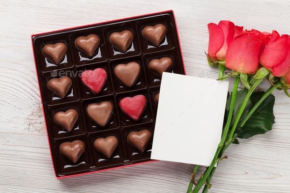 Valentines day with red roses and chocolate - Stock Photo - Images
