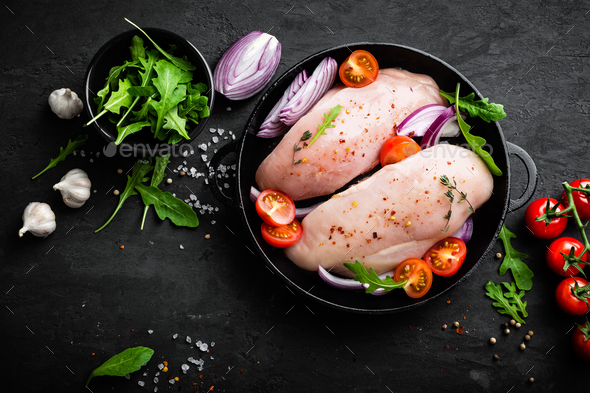 Raw whole chicken with fresh herbs and peas on black stone background, top  view. Culinary white meat eating. Organic chicken Stock Photo - Alamy