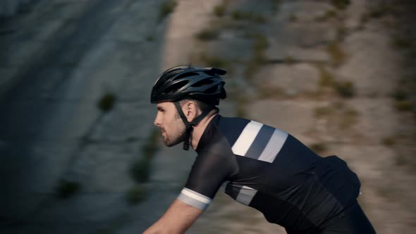 Triathlete Cyclist Training On Bicycle.Cyclist Fitness Riding On Road Bike Ready For Triathlon Race. alt