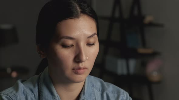 Young beautiful and happy Asian woman at home doing yoga body and mind relaxation alt