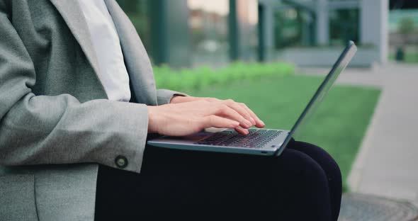 Close Up of Female Hands of Business Woman Professional User Worker Using Typing on Laptop alt