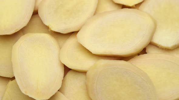 sliced ginger root rotate. Healthy food concept. alt