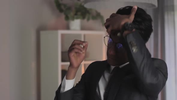 Medium closeup of young indian man gets ready for important job interview alt