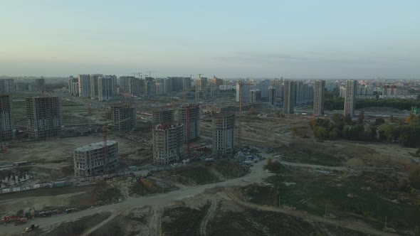 Construction site of a modern city block. High-rise buildings under construction.
