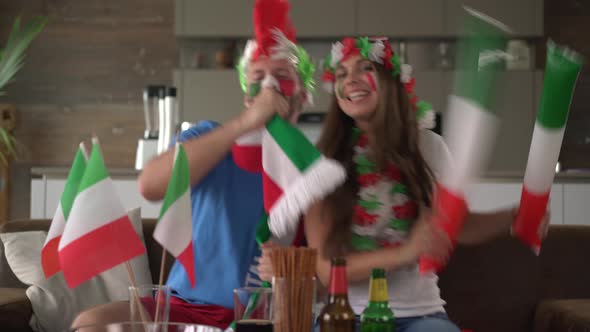 Fan Couple Cheering for Italy